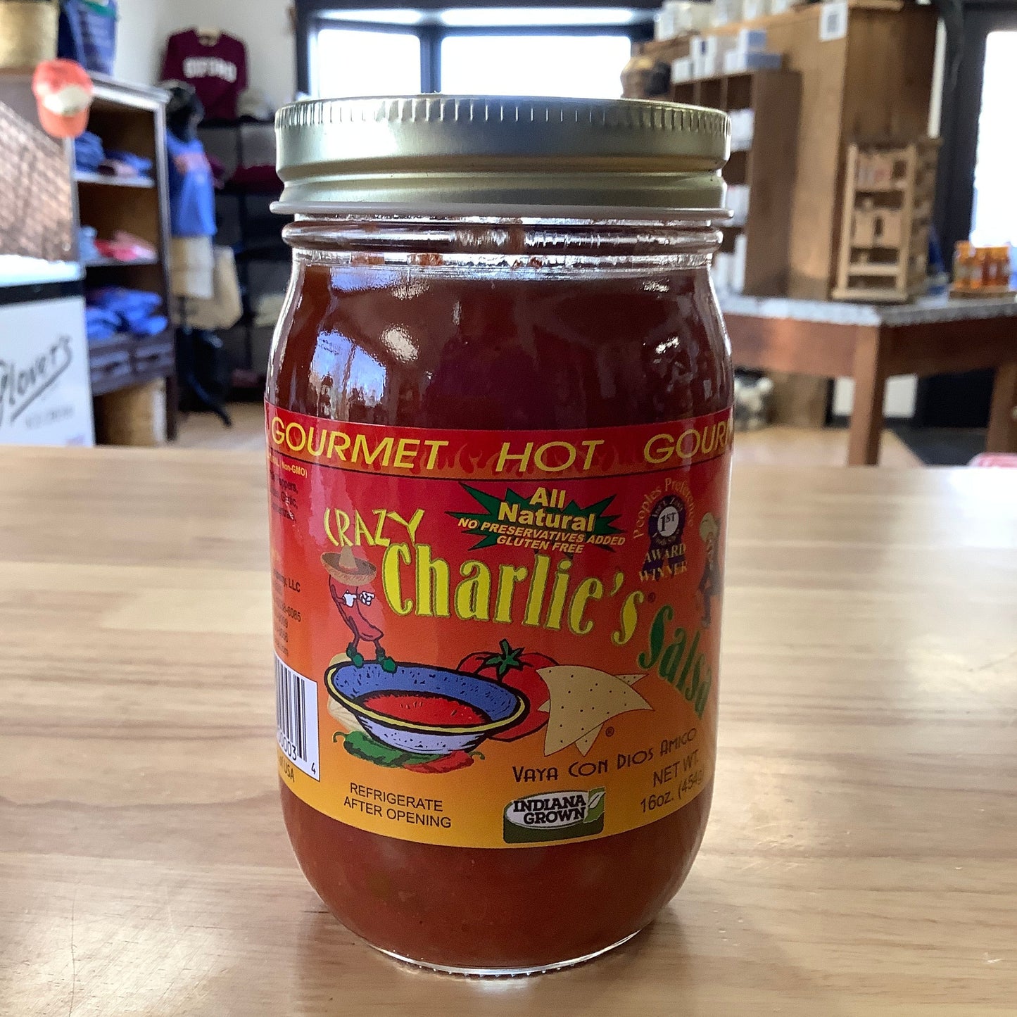 Jar of sauce with a visible label on a wooden surface