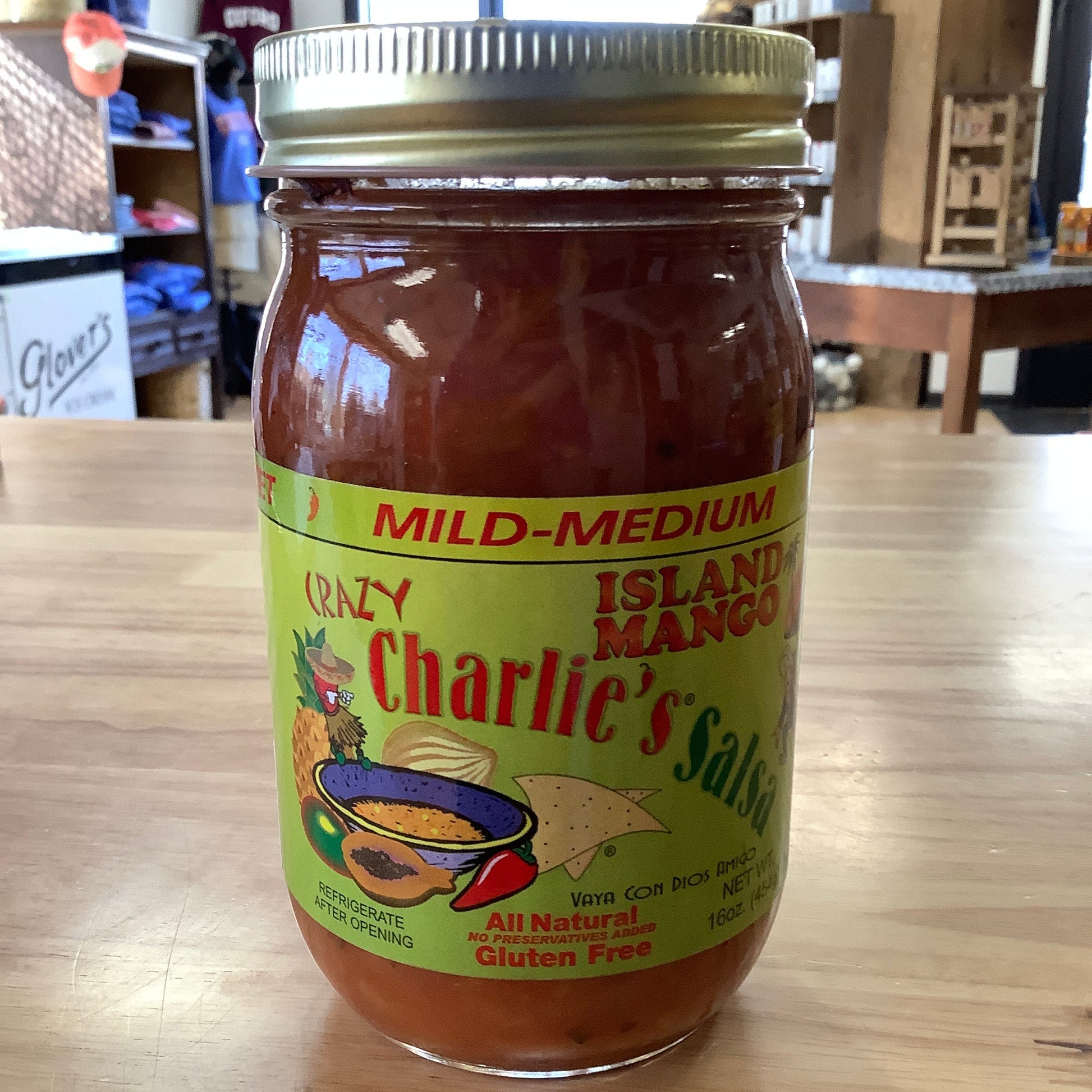 Jar of Charlie's Salsa on a wooden surface